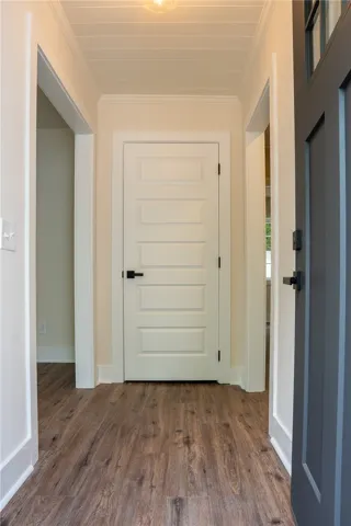 Step into this welcoming entryway featuring durable flooring and inviting light.