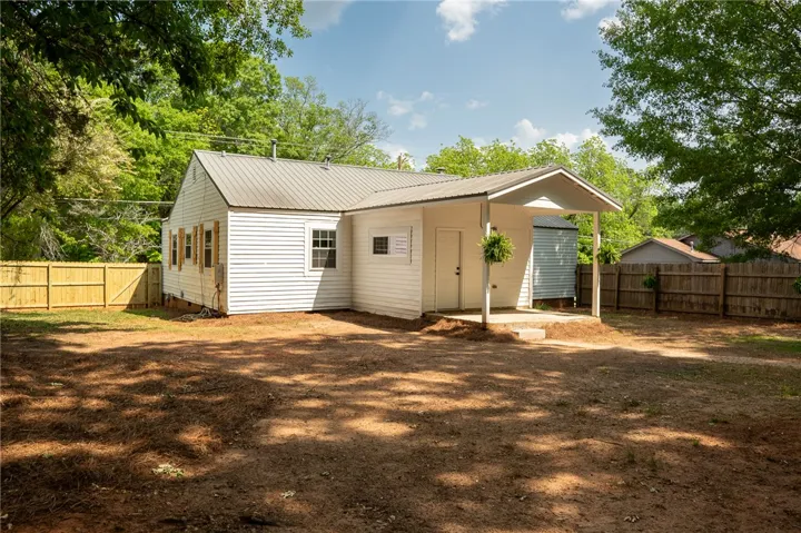 This charming home offers a spacious private yard, perfect for outdoor enjoyment and serene living.
