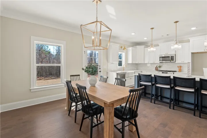 This open-concept space features warm hardwood floors and a well-appointed kitchen.