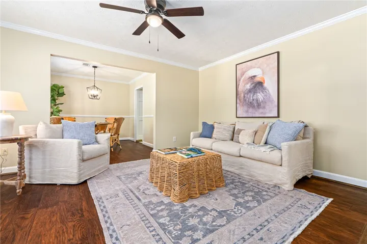 This inviting living area boasts hardwood floors and an open flow to the adjacent dining space.