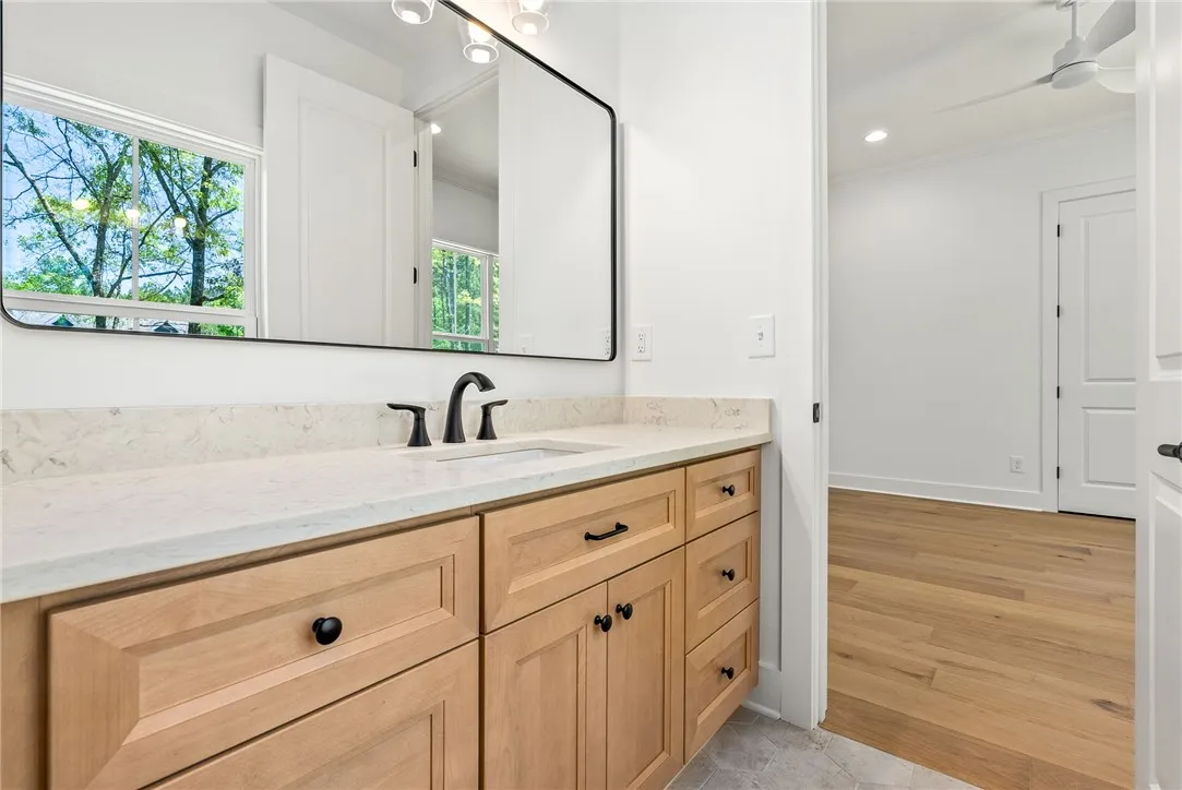 The spacious vanities in the Jack-and-Jill bath provide ample storage and space to each bedroom.