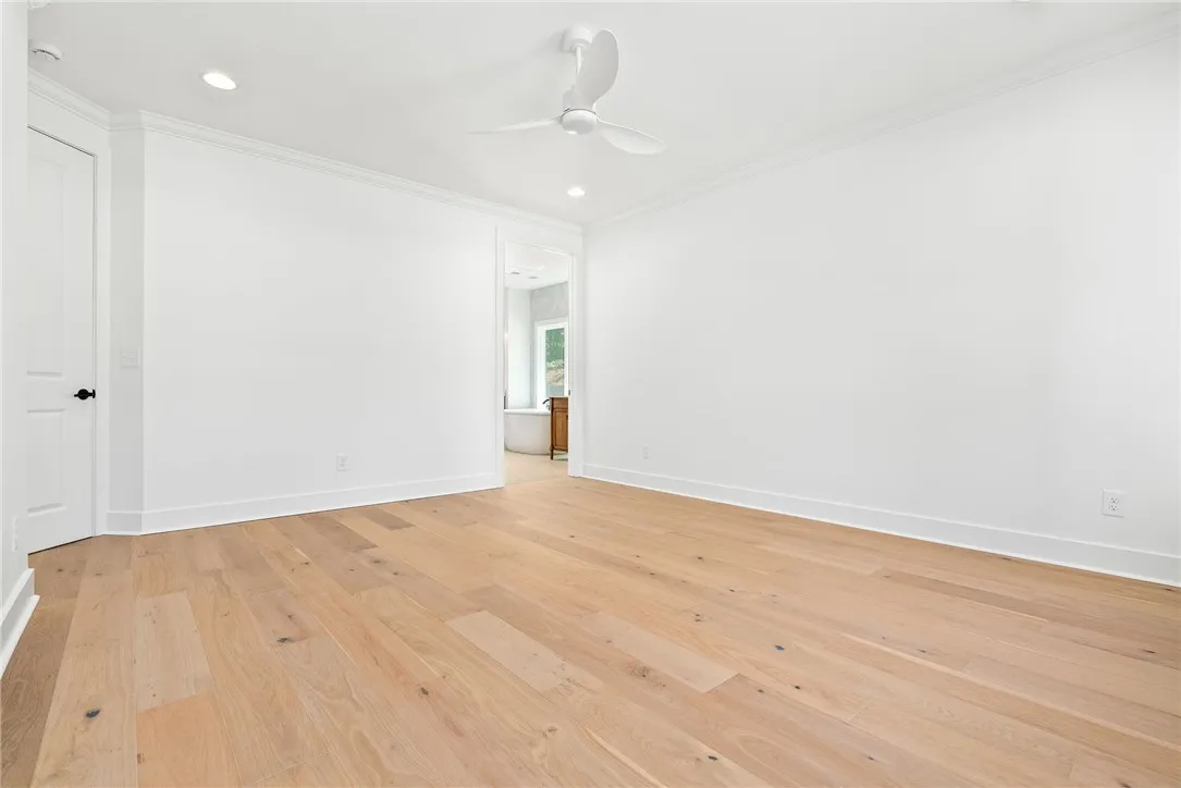 The primary bedroom connects directly to the impressive bath, laundry, mud bench, and owner’s entry.