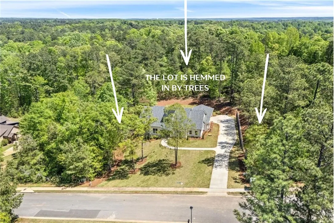 Offering a rare level of privacy for new construction, the home is completely hemmed in by trees, yet the residence maintains an expansive, usable yard.
