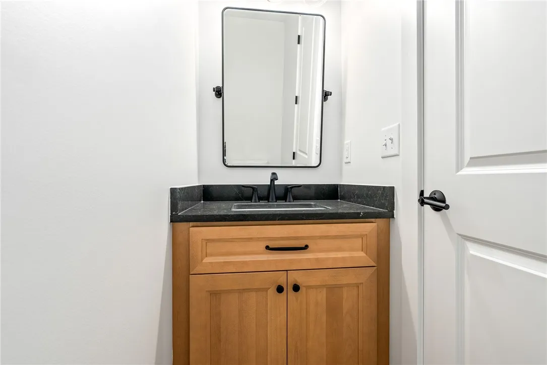 A half bath at the owner’s entry offers convenient access from the main living areas.