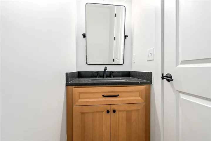 A half bath at the owner’s entry offers convenient access from the main living areas.
