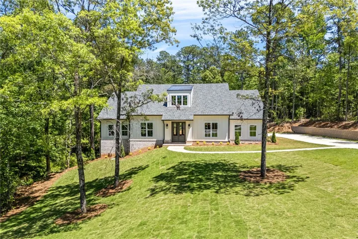 A generous front lawn and a tasteful elevation lend to an inviting presence and great curb appeal.