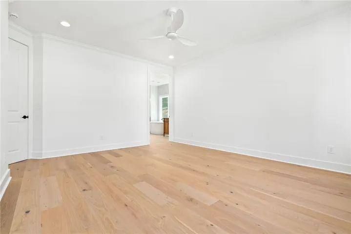 The primary bedroom connects directly to the impressive bath, laundry, mud bench, and owner’s entry.