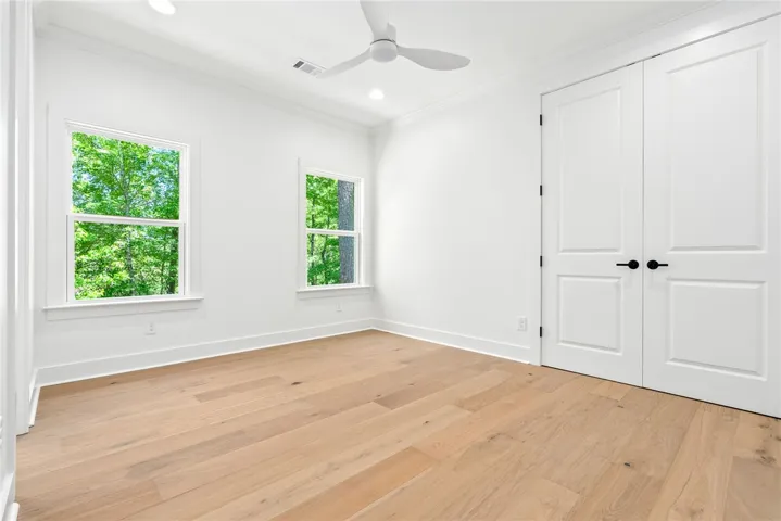 Wood flooring continues through all bedrooms.