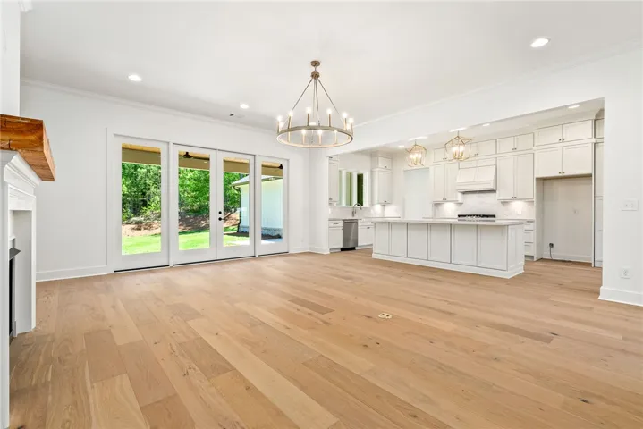The heart of the home is designed for gathering, with an open floorplan connecting the kitchen, living, & dining spaces.