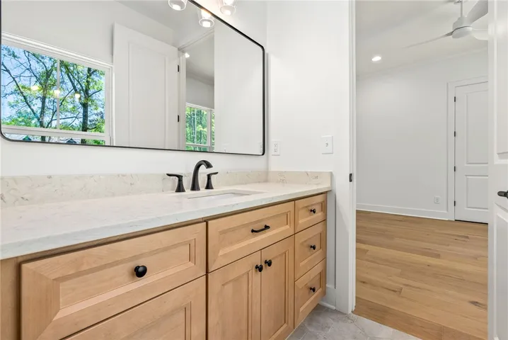 The spacious vanities in the Jack-and-Jill bath provide ample storage and space to each bedroom.