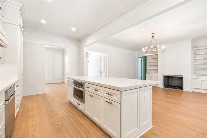 The heart of the home is designed for gathering, with an open floorplan connecting the kitchen, living, & dining spaces.