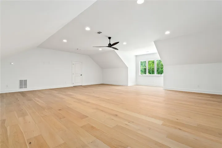 The expansive second-floor bonus room offers ample space for a variety of uses.