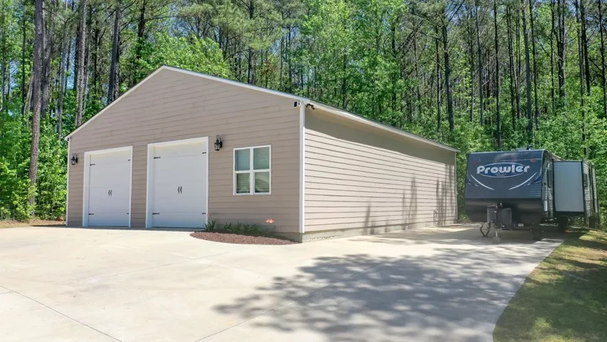 This 2,000 heated and cooled two-car workshop offers ample parking and additional storage options and 30 AMP for RV hookup