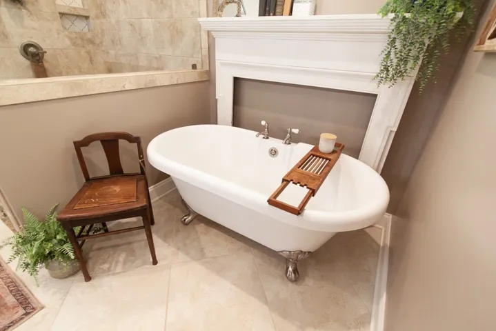 This serene bathing space features a freestanding tub, offering a tranquil retreat.