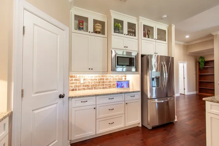 This kitchen showcases elegant cabinetry, modern appliances, and a seamless flow for everyday living.