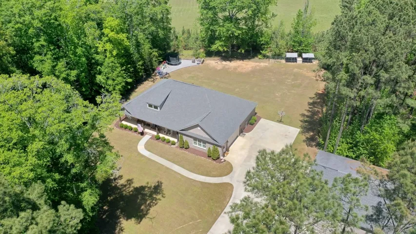 This spacious property offers a serene rural setting with ample outdoor recreation opportunities.