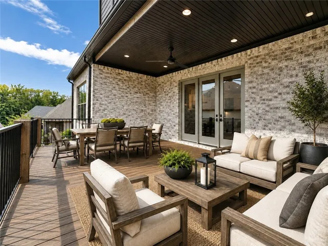 The porch is spacious enough to accommodate a dining and seating area. *Virtually staged.