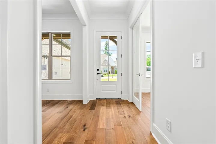 Welcome to 600 Overbrook Lane! The foyer is flanked by a dining room and study.