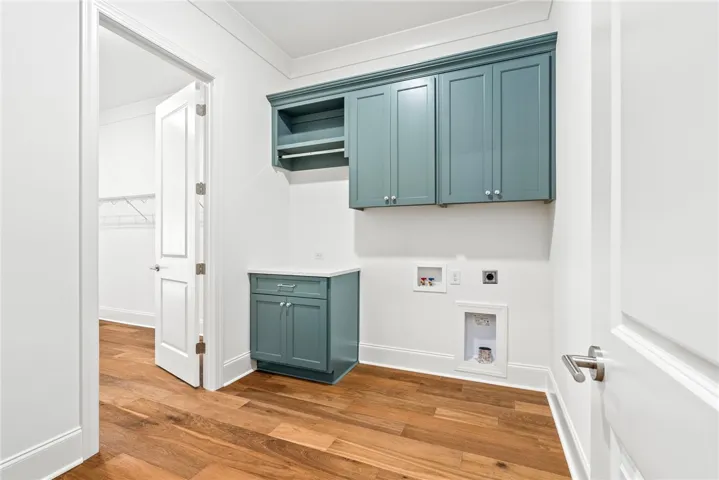 The laundry room is located at the owner's entry, with a second entrance from the primary closet.