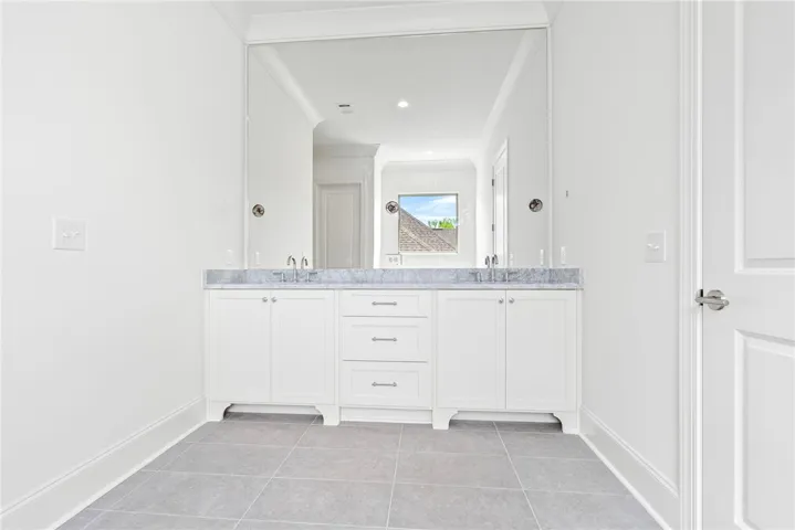 The primary bathroom offers a soaking tub, as well as a step-in shower.
