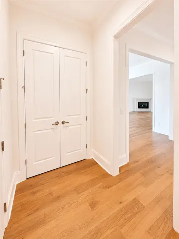 A storage closet just off the owner’s entry provides an ideal space for coats, cleaning supplies, and daily overflow.