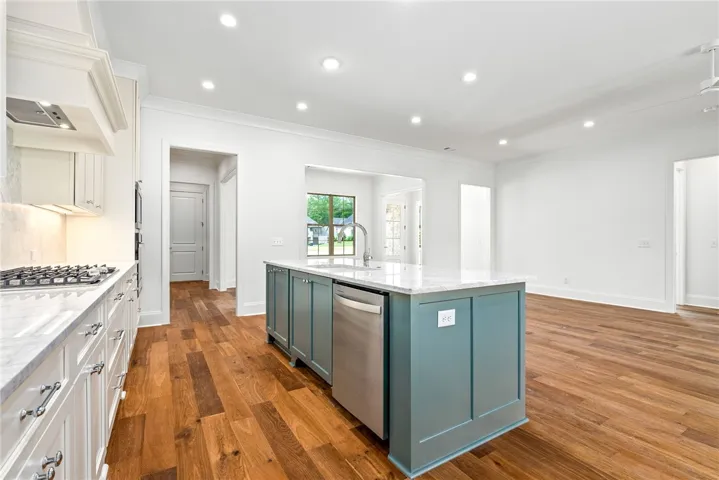 The kitchen and great room open directly to the porch, creating an easy connection for indoor-outdoor living.