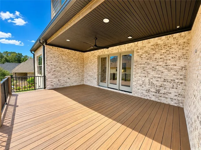 The porch is finished with durable composite decking designed to wear beautifully and hold up well over time.