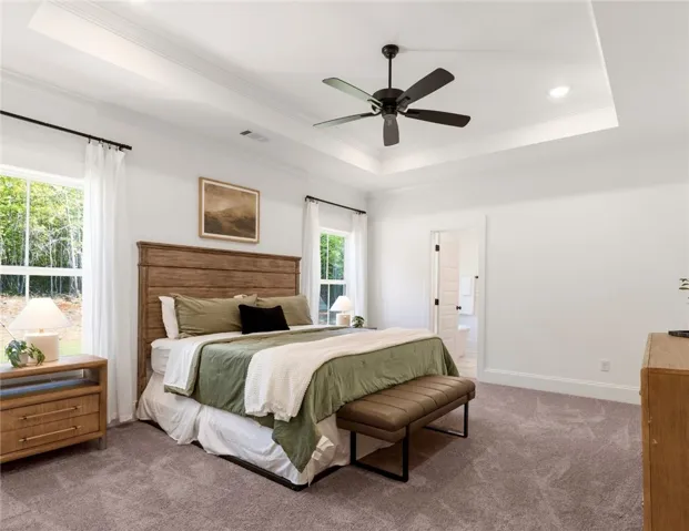 This tranquil bedroom offers comfort and a connection to nature, featuring elegant design details.