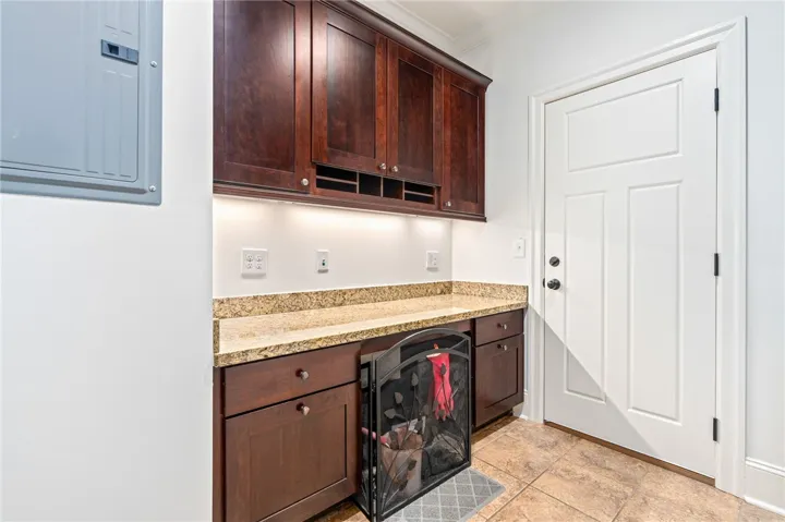 This functional space features rich cabinetry, practical countertops, and ample storage solutions for everyday needs.