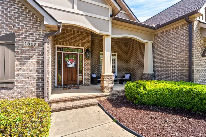 This charming front entrance features classic brick and inviting curb appeal.