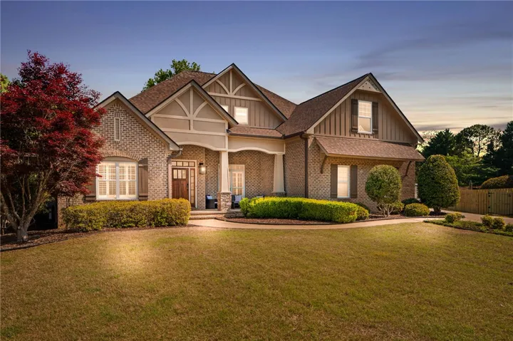 This charming home offers classic architectural details and a beautifully landscaped front yard.