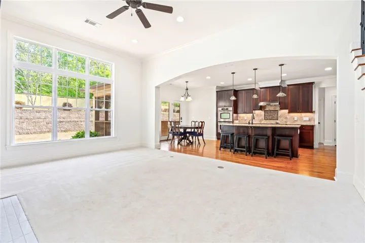 Bright and open living space with kitchen and dining area.