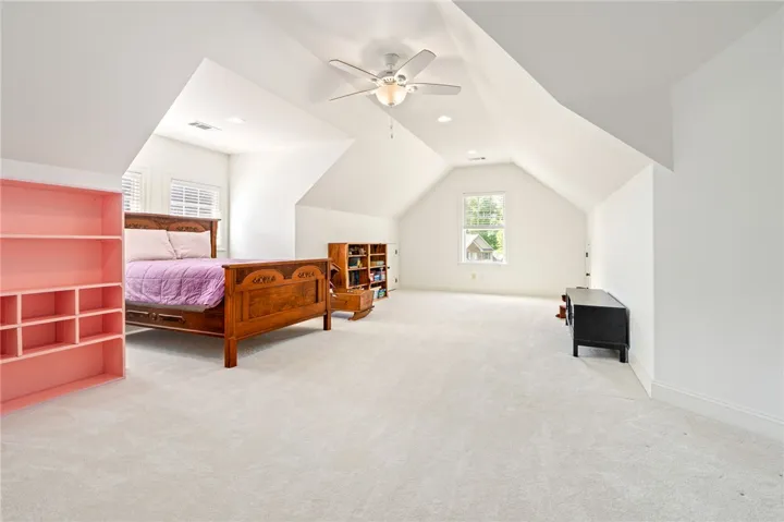 This spacious bedroom offers abundant natural light and ample room for personalization.