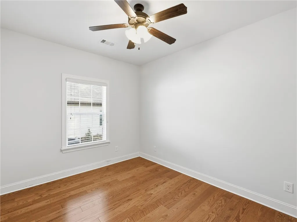 Bright and airy, this space features warm hardwood floors and abundant natural light, perfect for any lifestyle.
