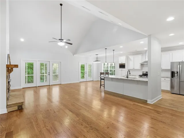 This expansive space merges living and kitchen areas, ideal for modern entertaining.