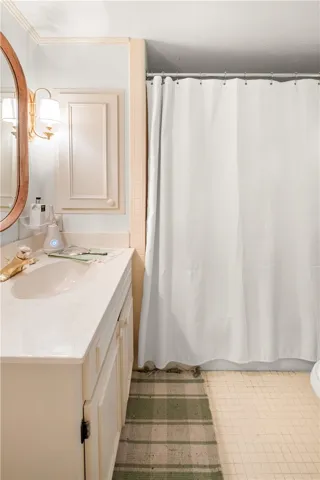 This bathroom features practical design and efficient use of space.