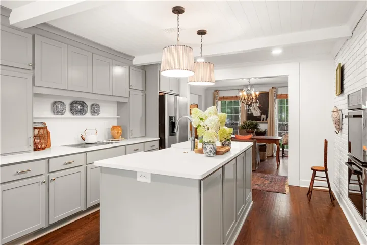 This spacious kitchen offers ample counter space and connects to a bright dining area, perfect for entertaining.