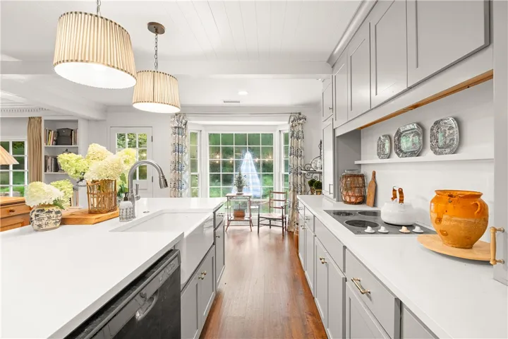 This spacious kitchen offers ample counter space, modern appliances, and abundant natural light.