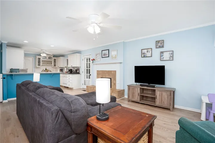 This inviting living space features an open floorplan, combining relaxation with a functional kitchen area.