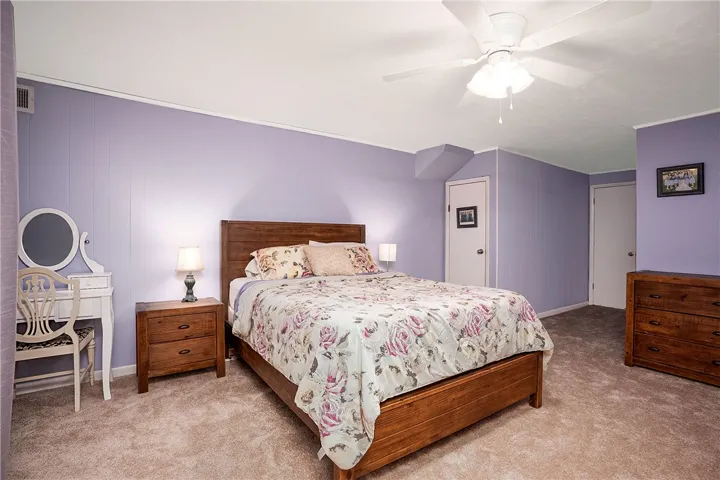 This restful bedroom offers a spacious layout for ultimate comfort.