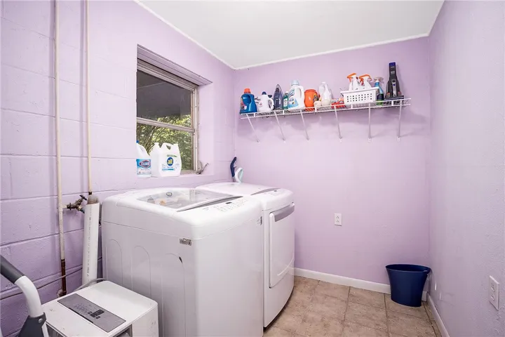 Functional laundry space with ample natural light.