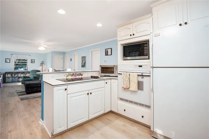 This bright kitchen features modern appliances and an open-concept design for effortless living.