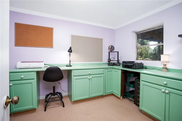 This dedicated workspace features ample storage, providing a practical and organized environment.