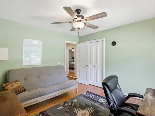 This versatile room offers hardwood floors and a bright, inviting atmosphere.
