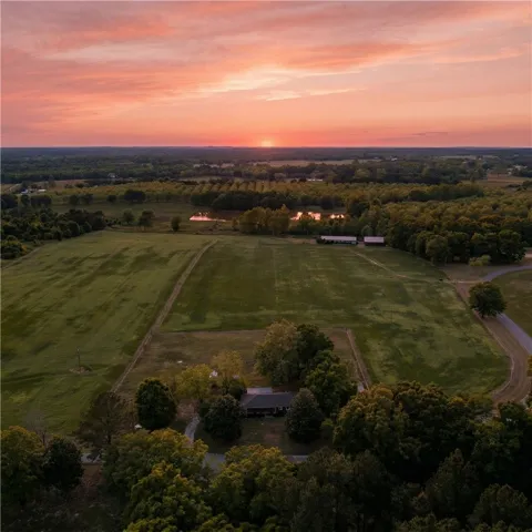 Witness the breathtaking expanse of this property at sunset.  AI generated photo.