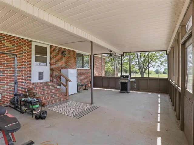 This spacious patio offers an inviting outdoor living area for relaxation and entertaining.