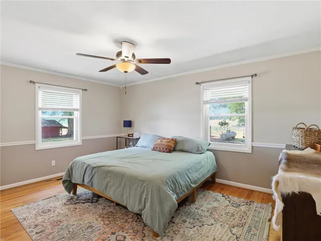 This cozy bedroom features warm hardwood floors.