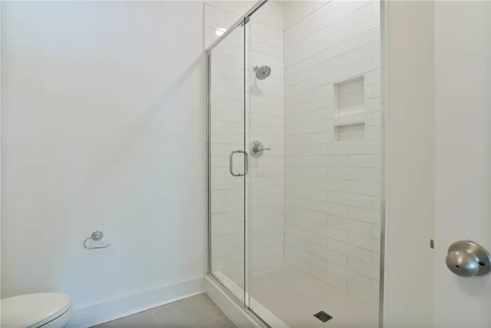 Primary bathroom, full tile walk in shower with glass doors!