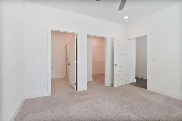 Primary Bedroom, and entryway to large walkin closet and primary bathroom