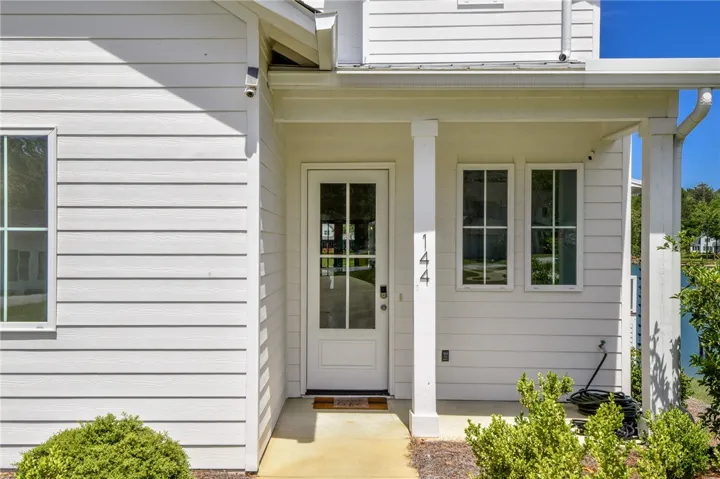 This inviting home showcases a clean facade and ample natural light, perfect for welcoming guests.